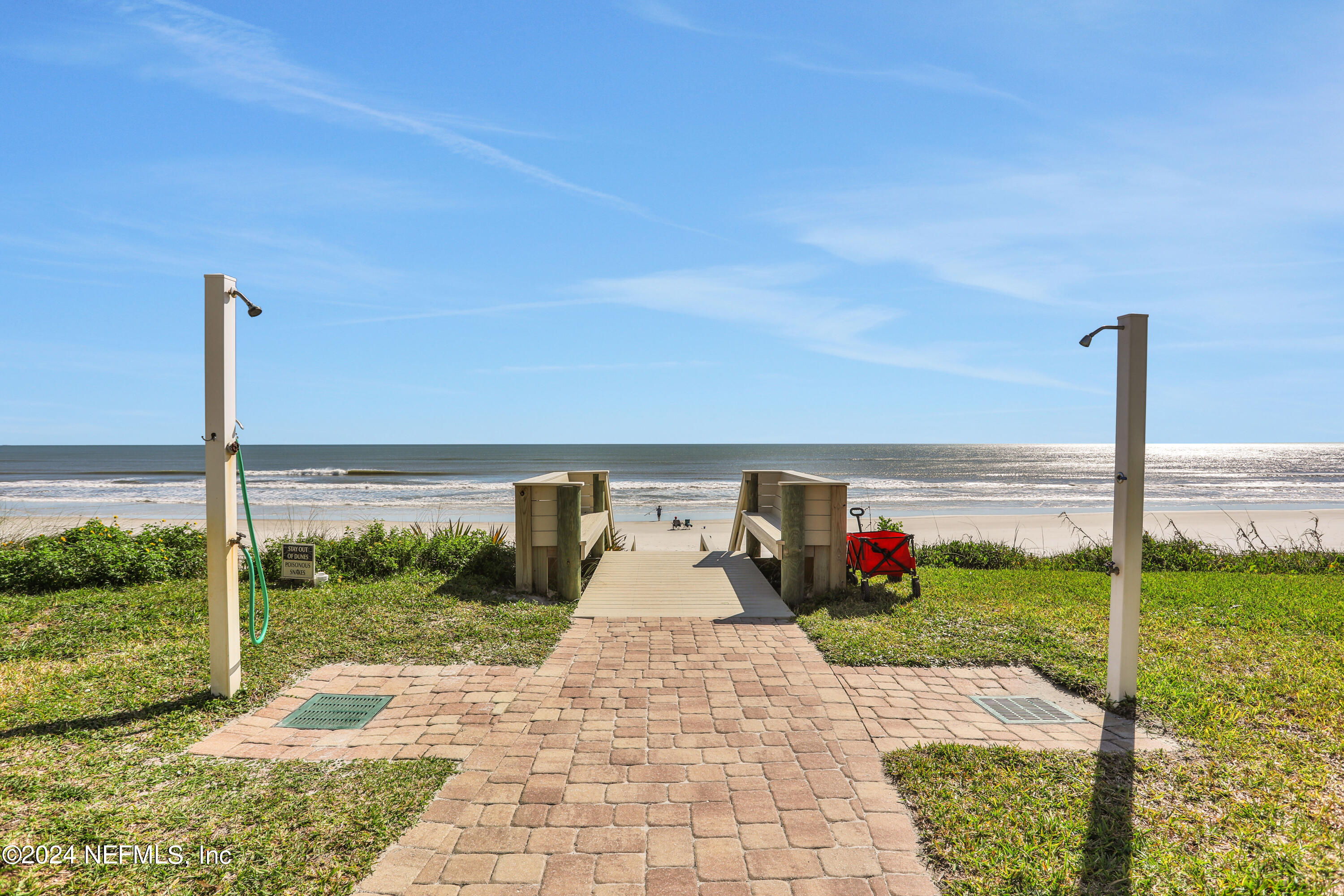 8050 A1A South, Unit 503 St. Augustine, FL 32080 - Photo 37 of 46 a view of a patio with a table and chairs
