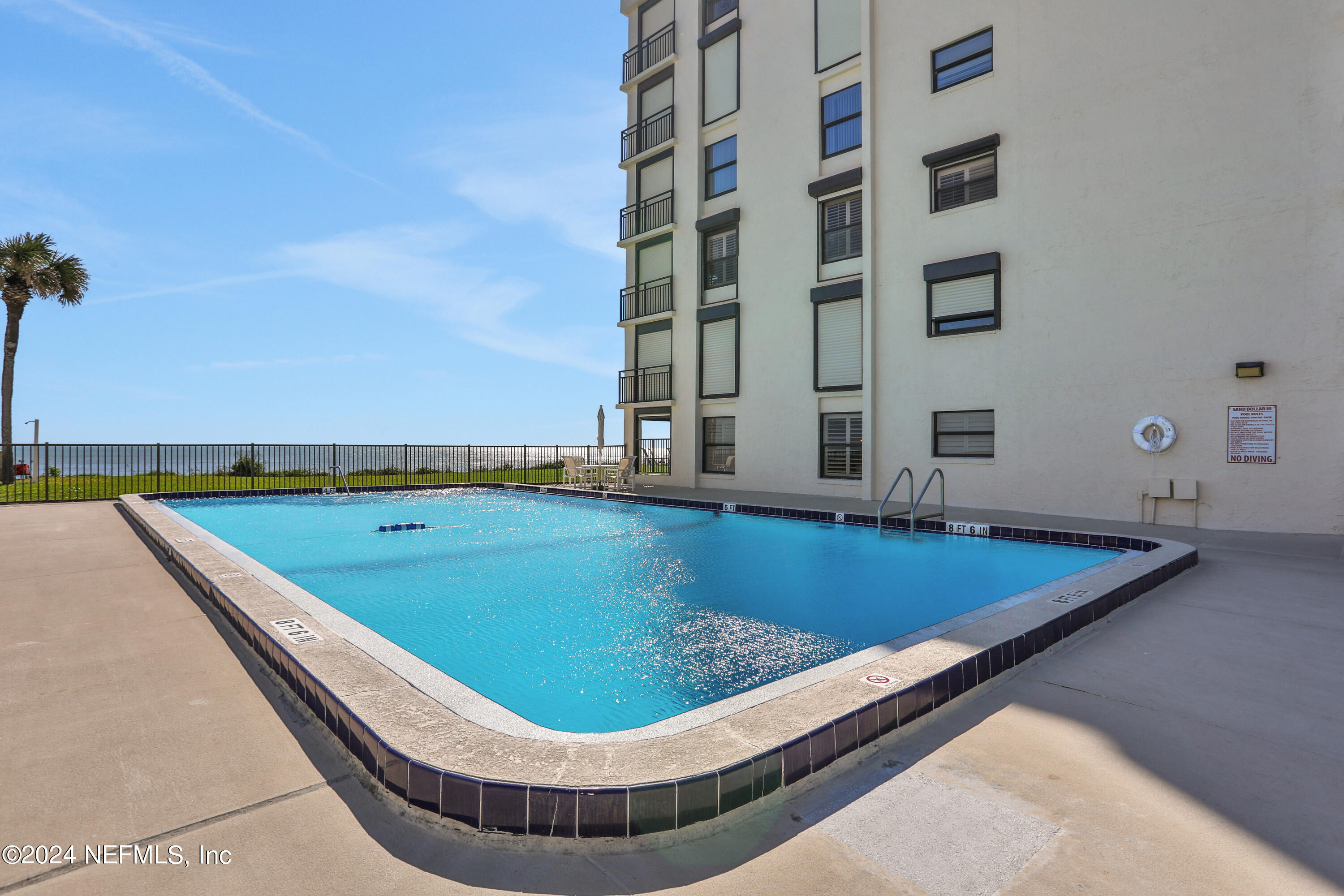 8050 A1A South, Unit 503 St. Augustine, FL 32080 - Photo 42 of 46 a view of a pool with chairs