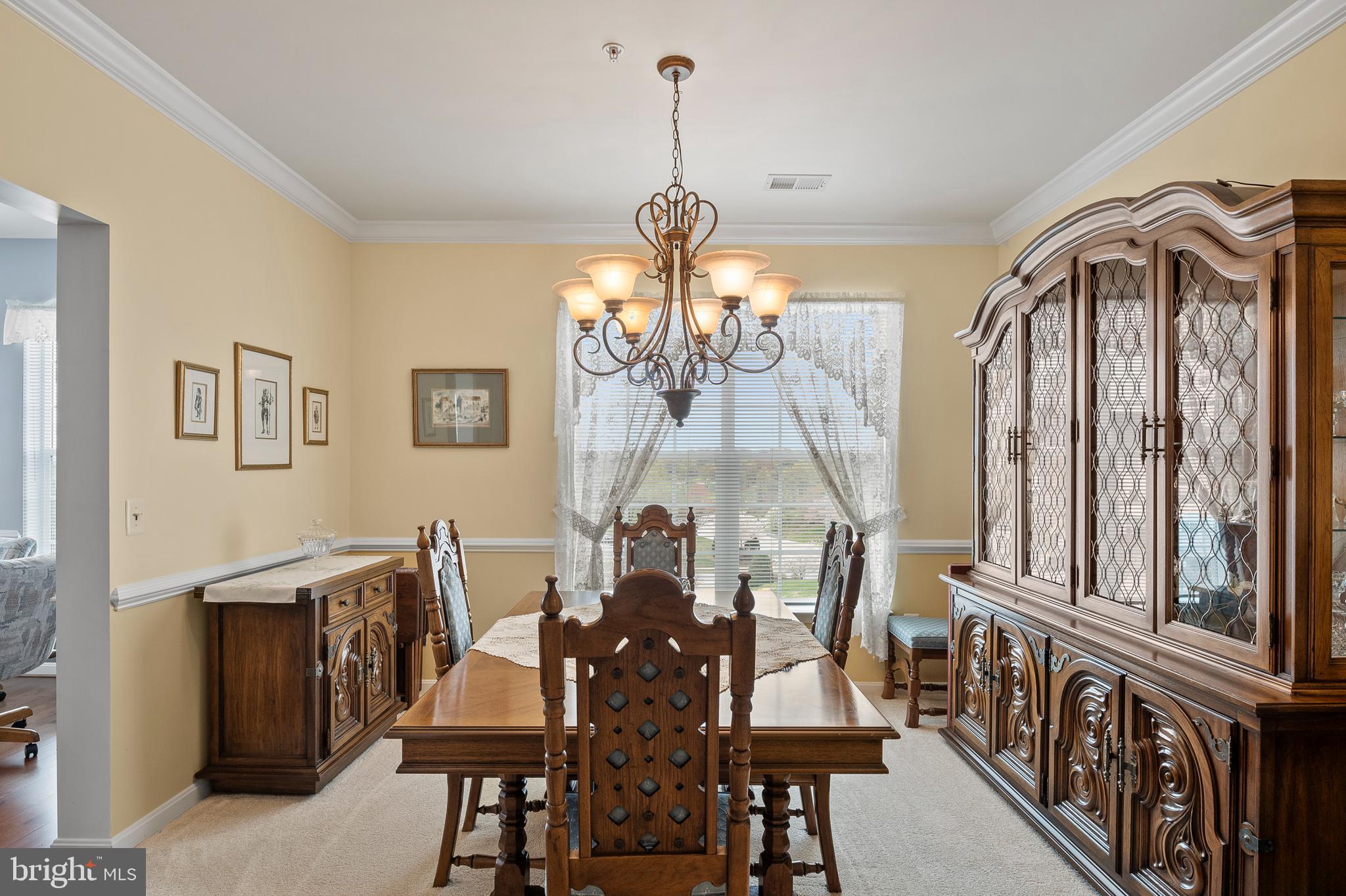 7305 Maplecrest Road, Unit 402 Elkridge, MD 21075 - Photo 12 of 55 a view of a dining room with furniture and chandelier