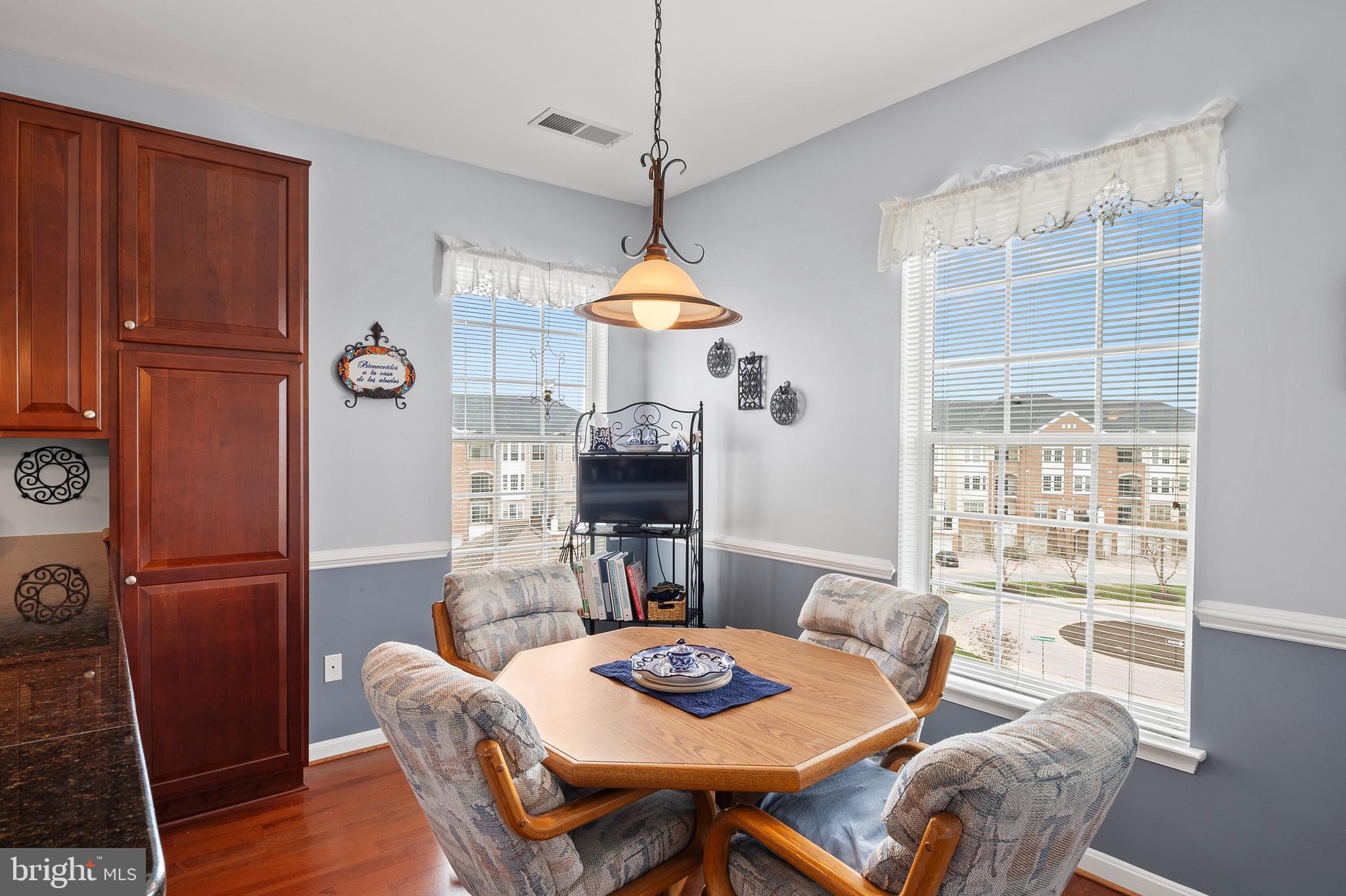 7305 Maplecrest Road, Unit 402 Elkridge, MD 21075 - Photo 15 of 55 a dining room with furniture and window