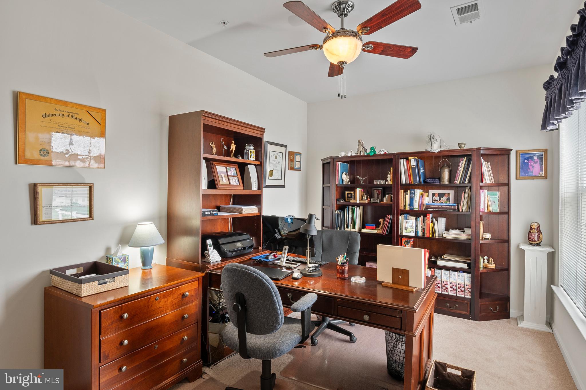7305 Maplecrest Road, Unit 402 Elkridge, MD 21075 - Photo 16 of 55 a view of a workspace with furniture and a bookshelf