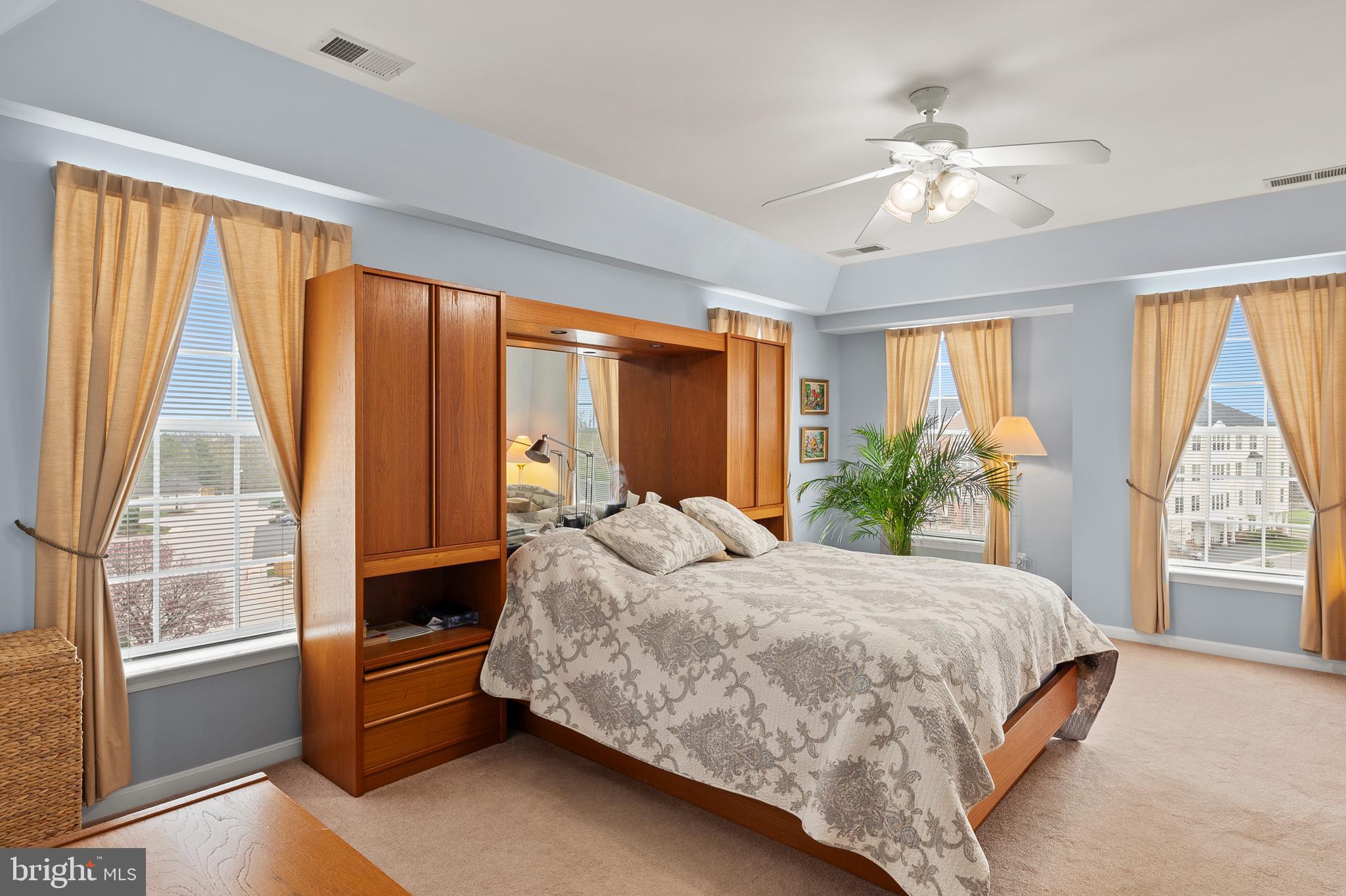 7305 Maplecrest Road, Unit 402 Elkridge, MD 21075 - Photo 17 of 55 a bedroom with a large bed and a chandelier