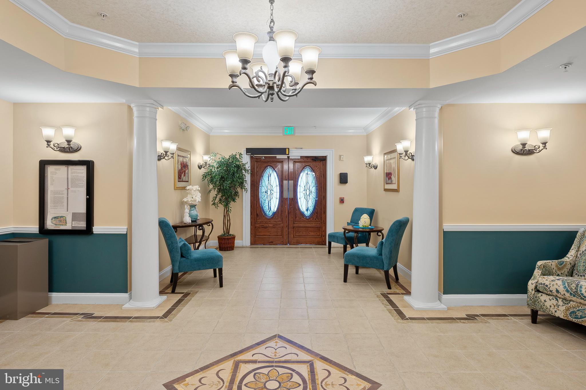 7305 Maplecrest Road, Unit 402 Elkridge, MD 21075 - Photo 2 of 55 a living room with furniture and a chandelier