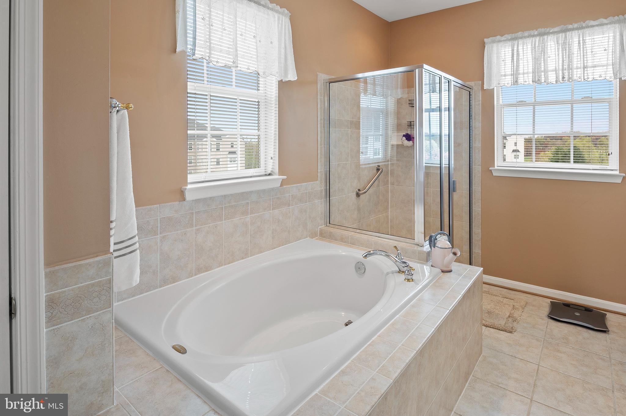 7305 Maplecrest Road, Unit 402 Elkridge, MD 21075 - Photo 20 of 55 a bathroom with shower and a bathtub