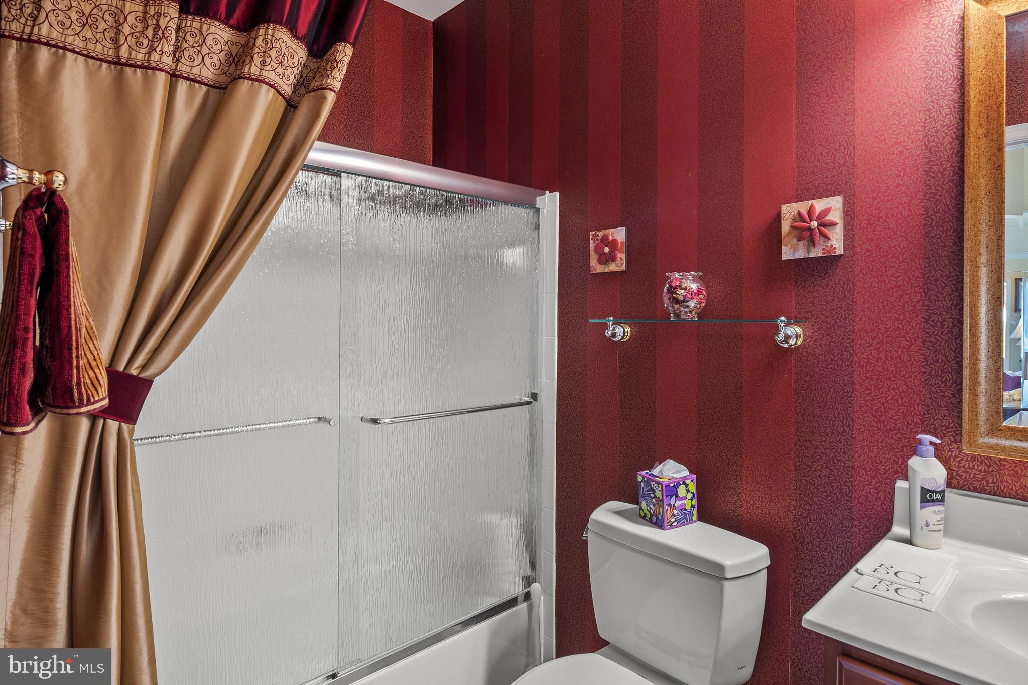 7305 Maplecrest Road, Unit 402 Elkridge, MD 21075 - Photo 22 of 55 a white toilet sitting next to a white sink