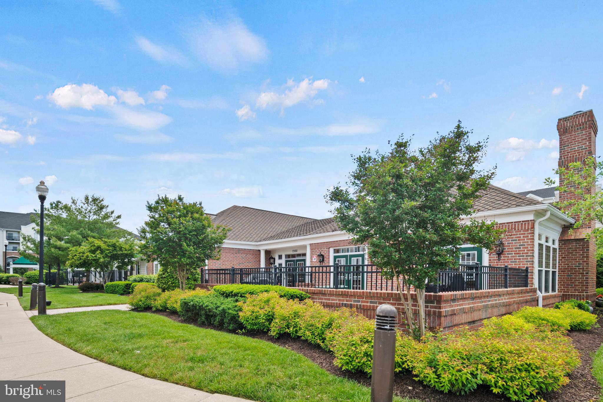 7305 Maplecrest Road, Unit 402 Elkridge, MD 21075 - Photo 32 of 55 a front view of a house with a yard