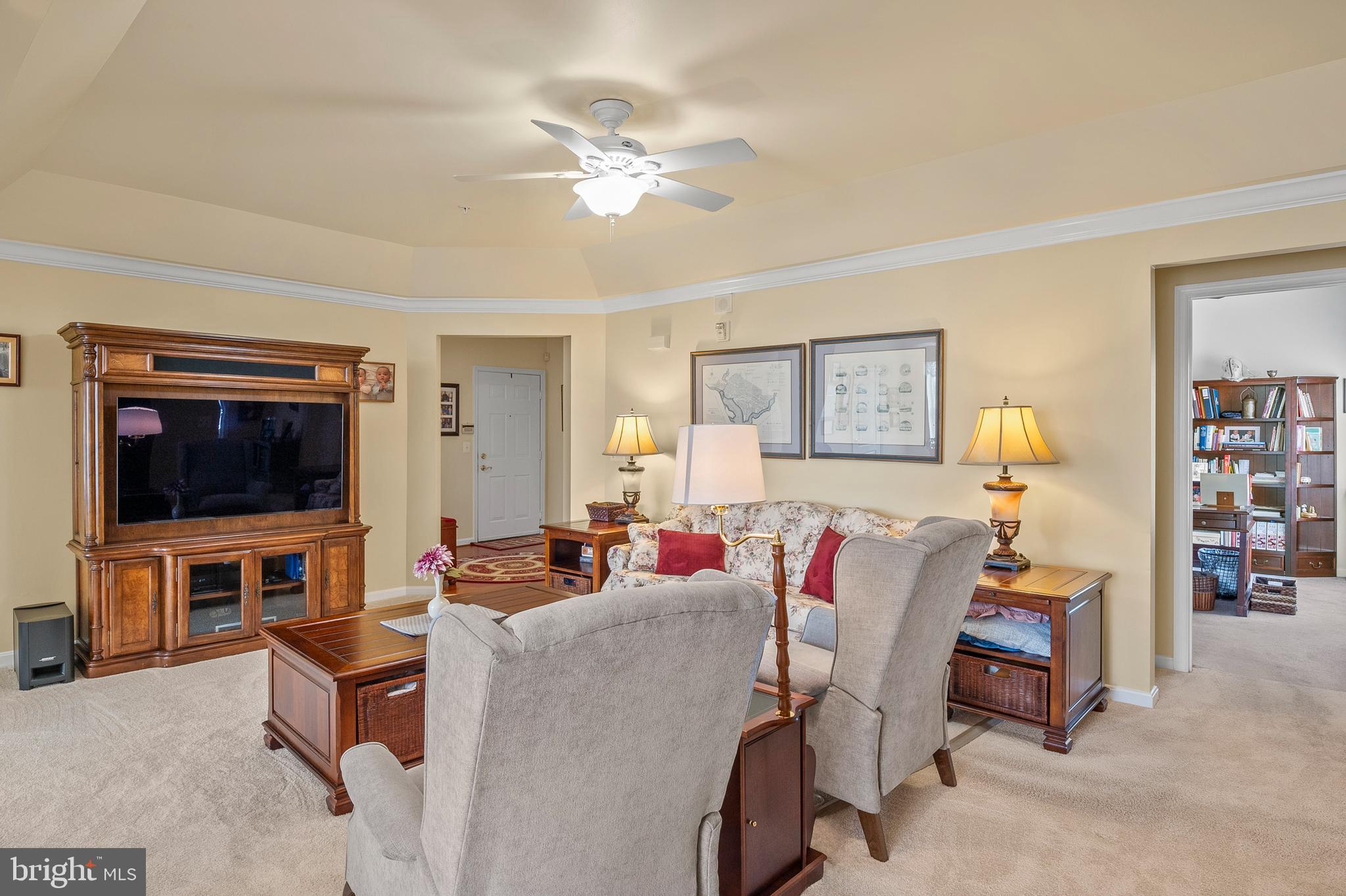 7305 Maplecrest Road, Unit 402 Elkridge, MD 21075 - Photo 9 of 55 a living room with furniture and a flat screen tv