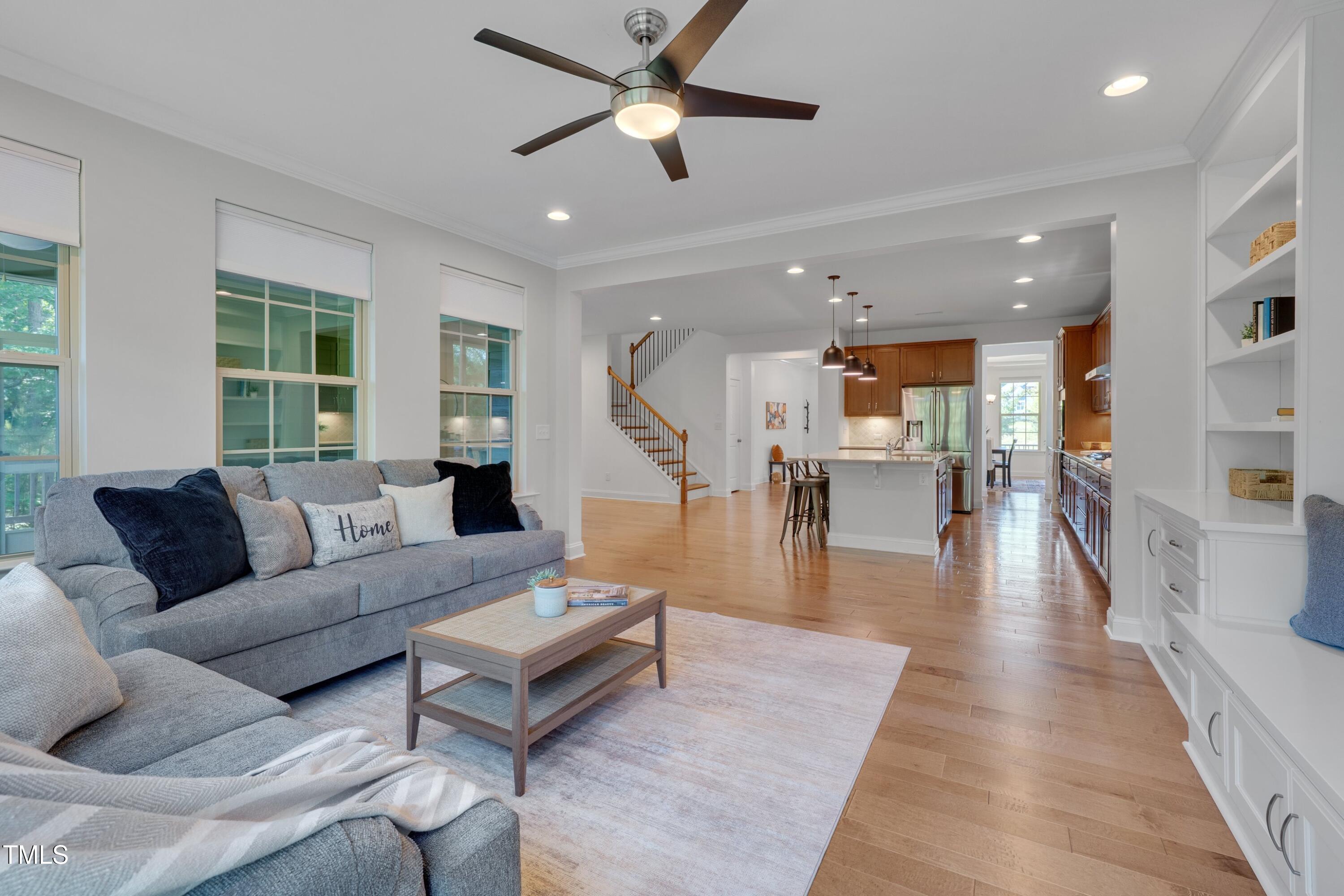 1680 Mint River Drive Apex, NC 27502 - Photo 15 of 47 Living room adjacent to kitchen