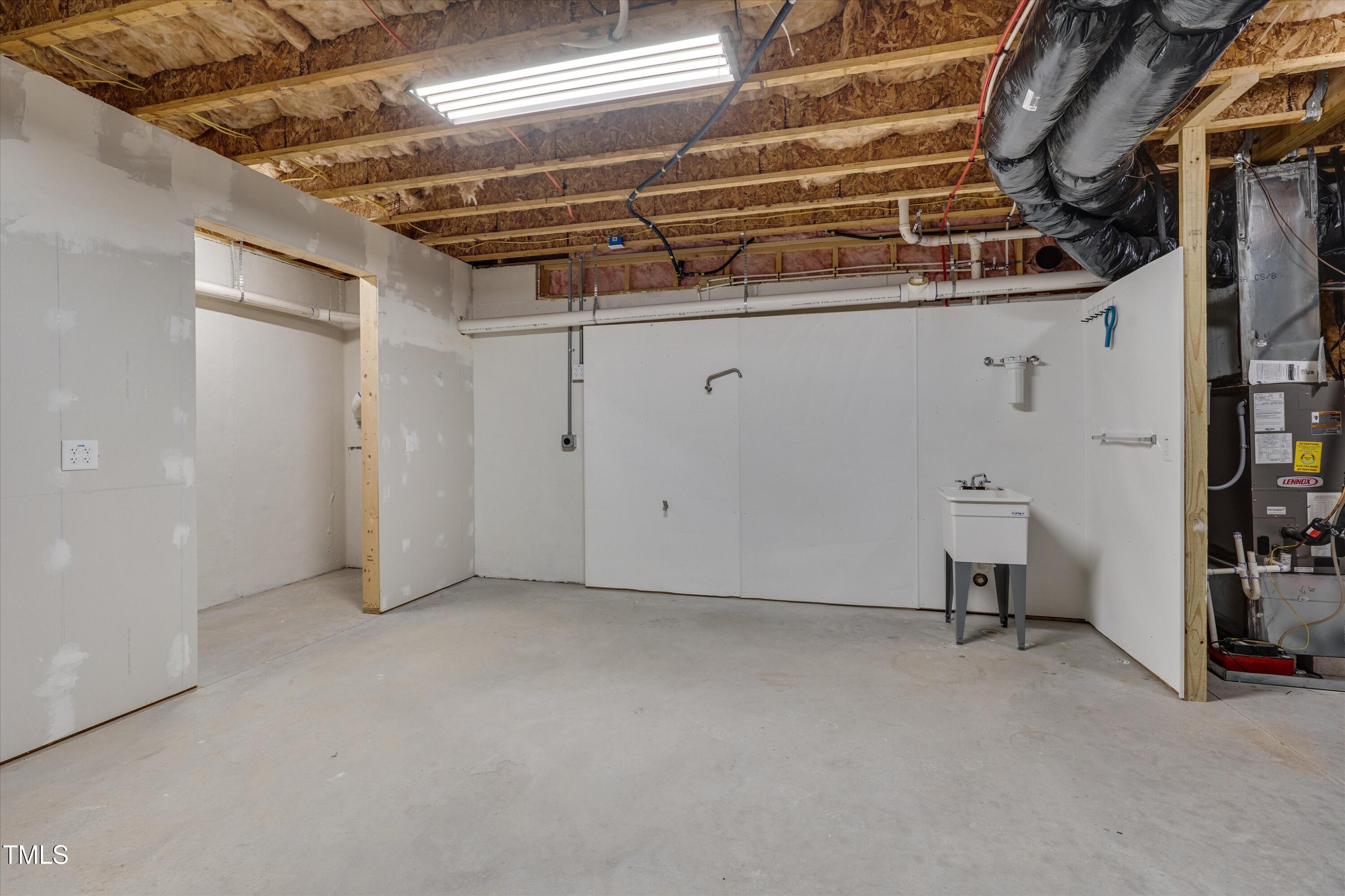 1680 Mint River Drive Apex, NC 27502 - Photo 40 of 47 Unfinished basement w/ utility sink