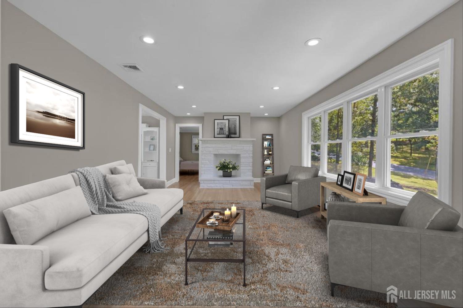 a living room with furniture and a large window