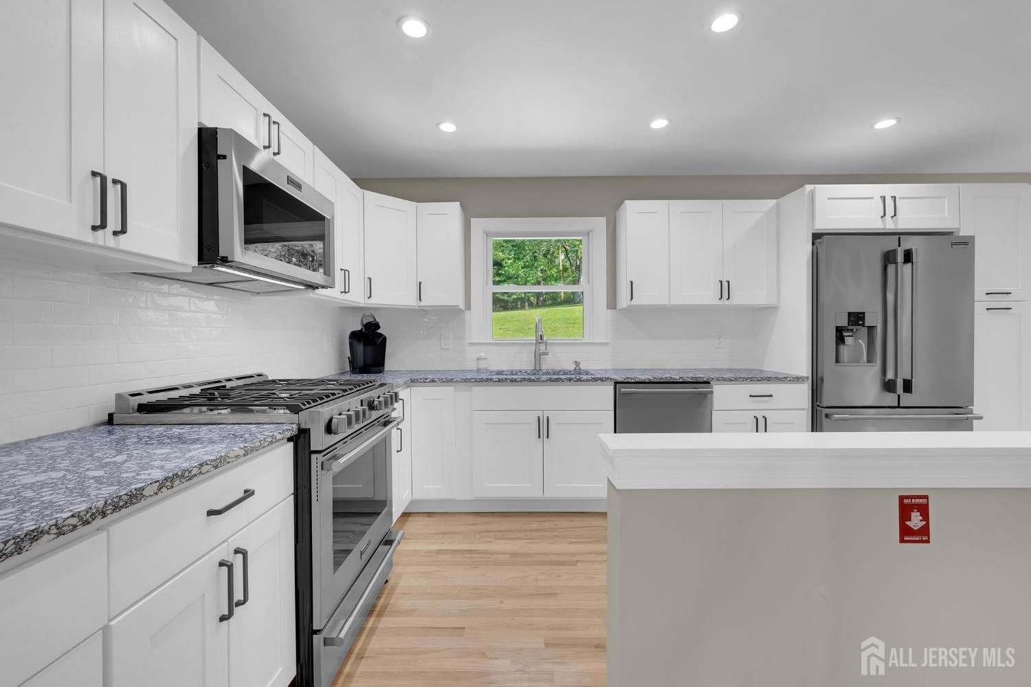 205 Hockenbury Road Hillsborough, NJ 08844 - Photo 15 of 38 a kitchen with stainless steel appliances granite countertop a stove and a sink