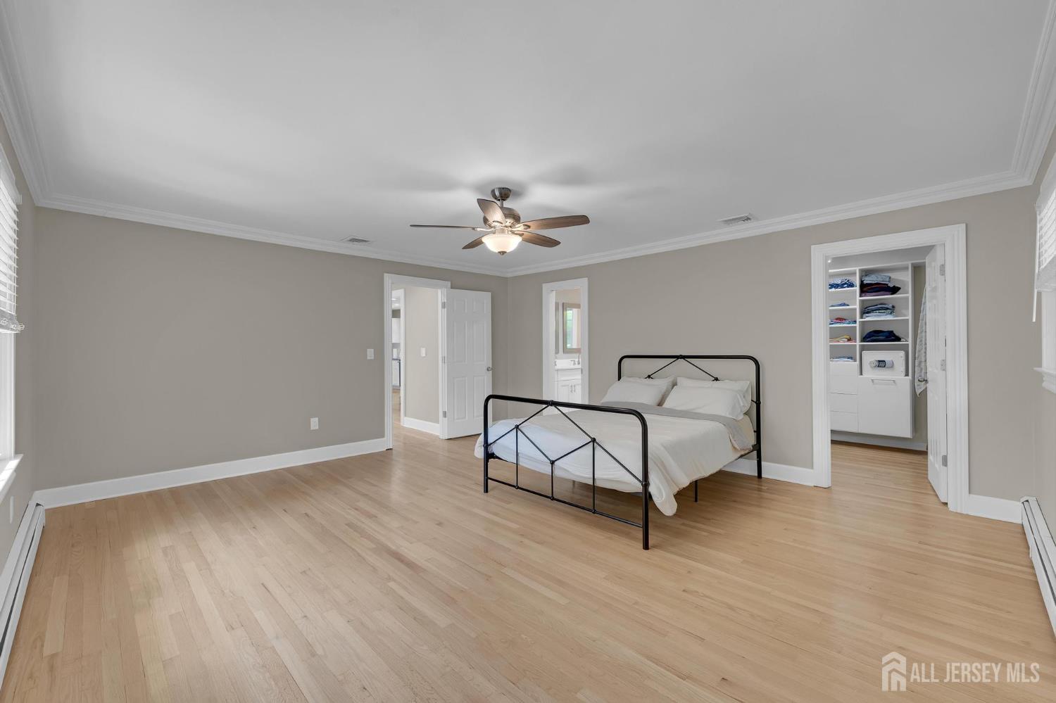 205 Hockenbury Road Hillsborough, NJ 08844 - Photo 17 of 38 a spacious bedroom with a bed and a desk