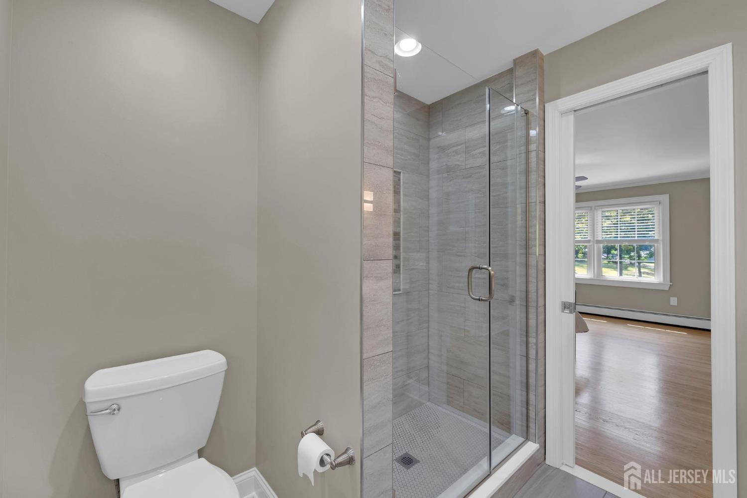 205 Hockenbury Road Hillsborough, NJ 08844 - Photo 20 of 38 a bathroom with a shower and toilet