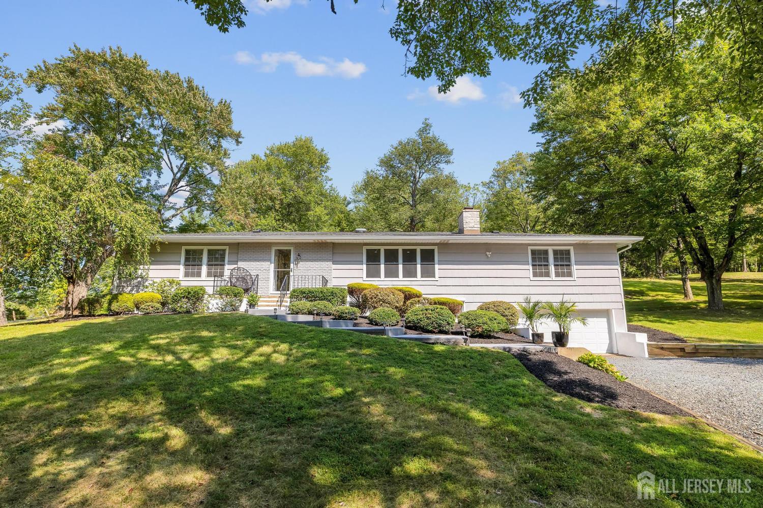 205 Hockenbury Road Hillsborough, NJ 08844 - Photo 2 of 38 a front view of house with yard and green space
