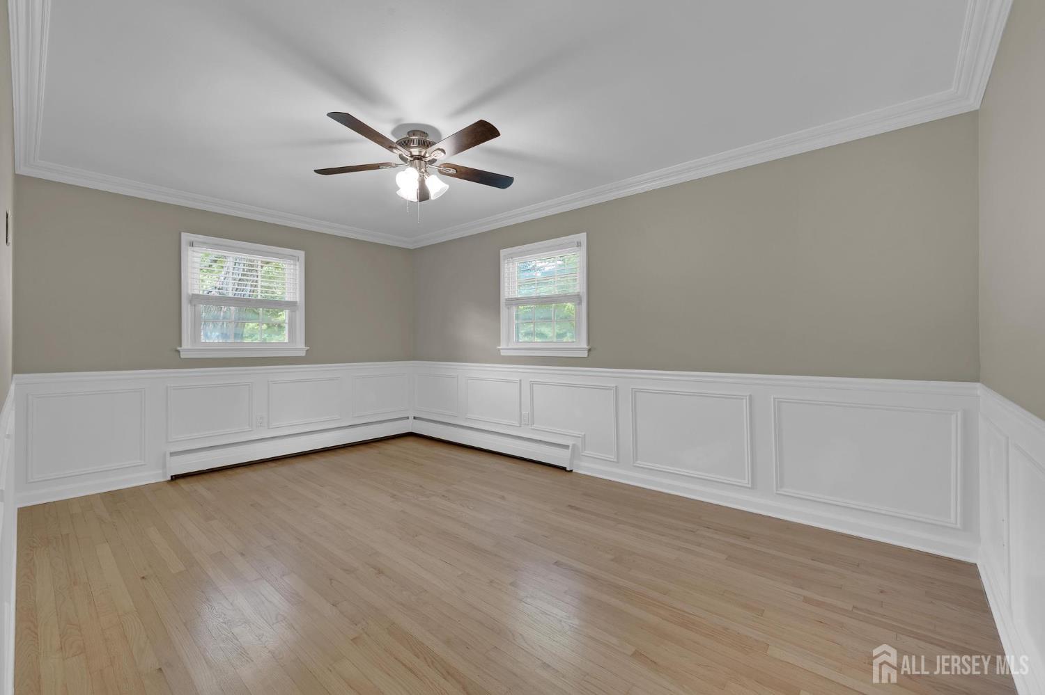 205 Hockenbury Road Hillsborough, NJ 08844 - Photo 24 of 38 a view of an empty room with wooden floor and a window