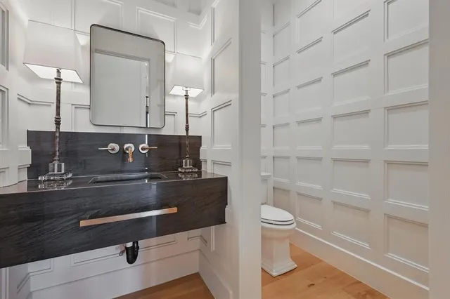 a room with lots of furniture and a book shelf