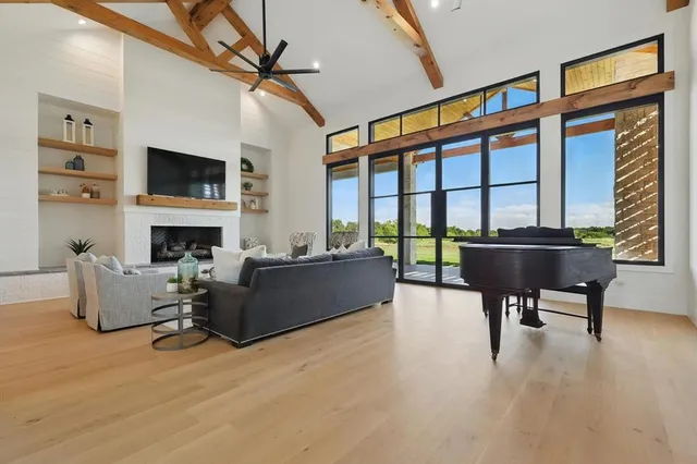 a living room with furniture and a large window