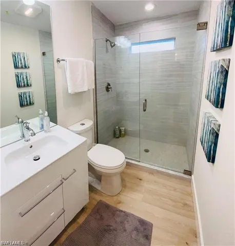 a bathroom with a toilet sink and shower