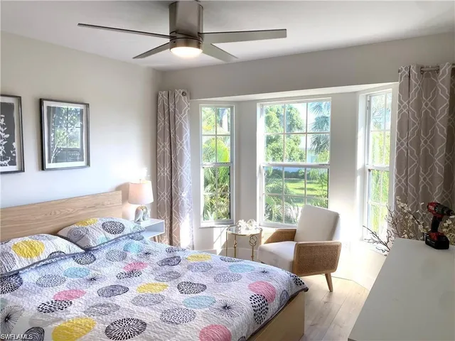 a bedroom with a bed and a couch