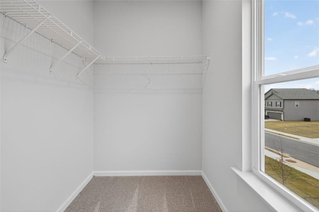 303 Roxeywood Way Winder, GA 30680 - Photo 20 of 47 a view of small space with racks on the wall