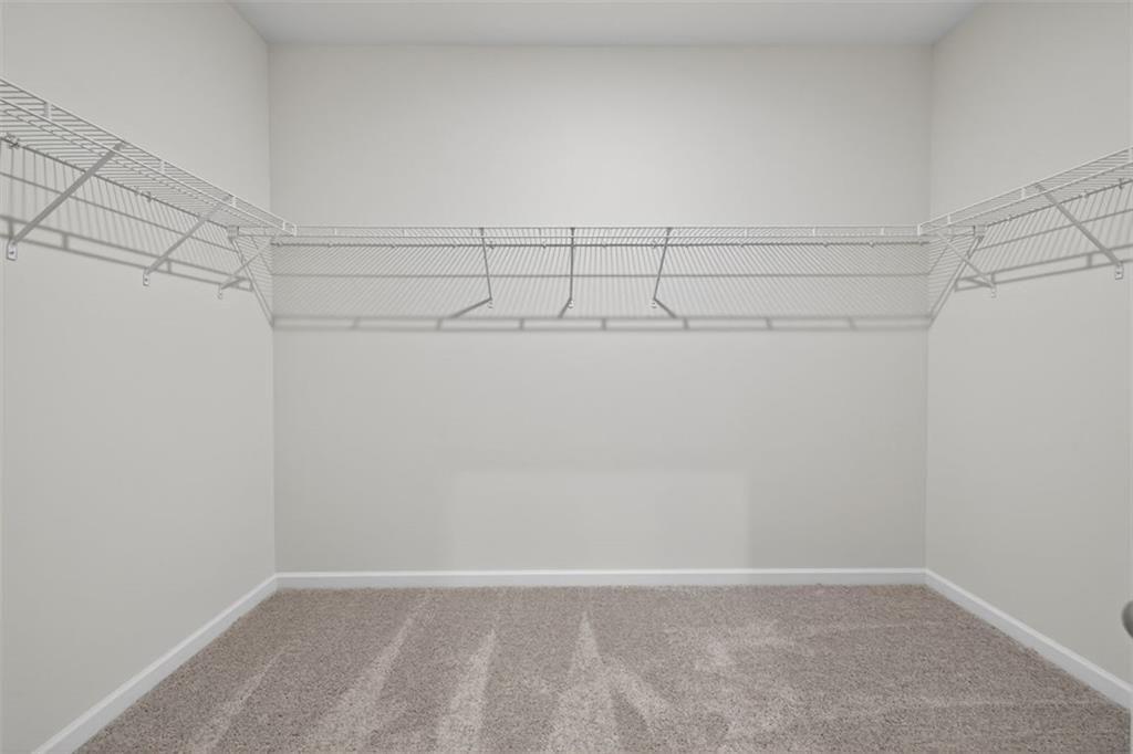 303 Roxeywood Way Winder, GA 30680 - Photo 32 of 47 a view of a room with racks on the wall