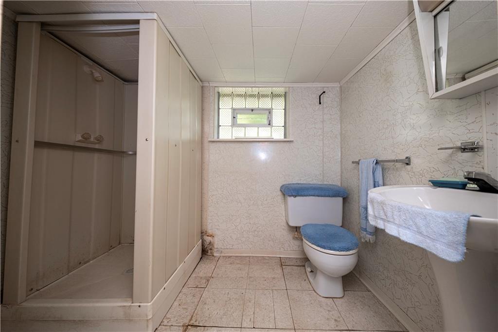 462 Crawford Run Road Cheswick, PA 15024 - Photo 14 of 39 a bathroom with a toilet and a shower
