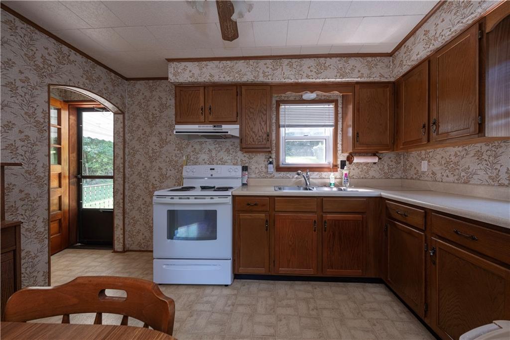 462 Crawford Run Road Cheswick, PA 15024 - Photo 19 of 39 a kitchen with a sink cabinets and window