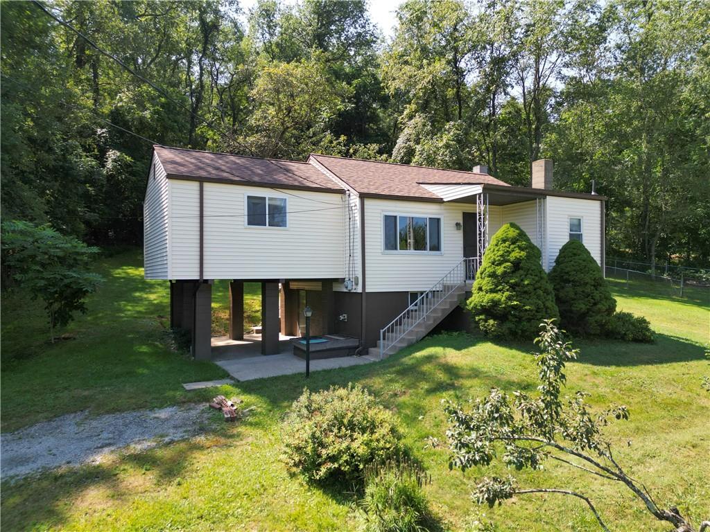 462 Crawford Run Road Cheswick, PA 15024 - Photo 2 of 39 a view of a house with backyard and garden