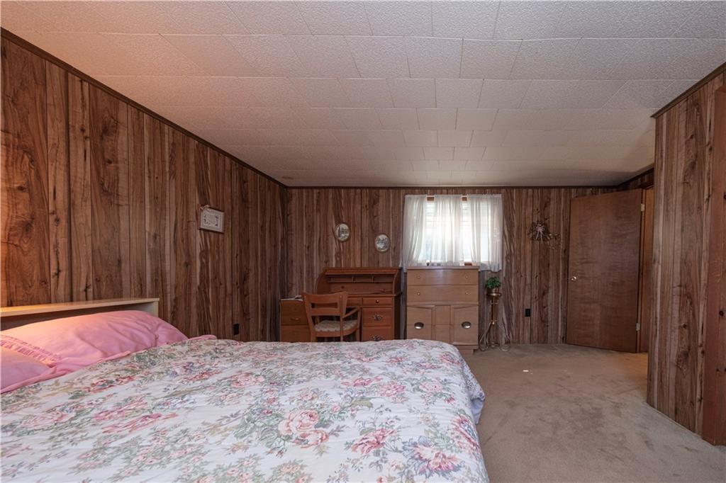 462 Crawford Run Road Cheswick, PA 15024 - Photo 23 of 39 a bedroom with a bed and wooden furniture