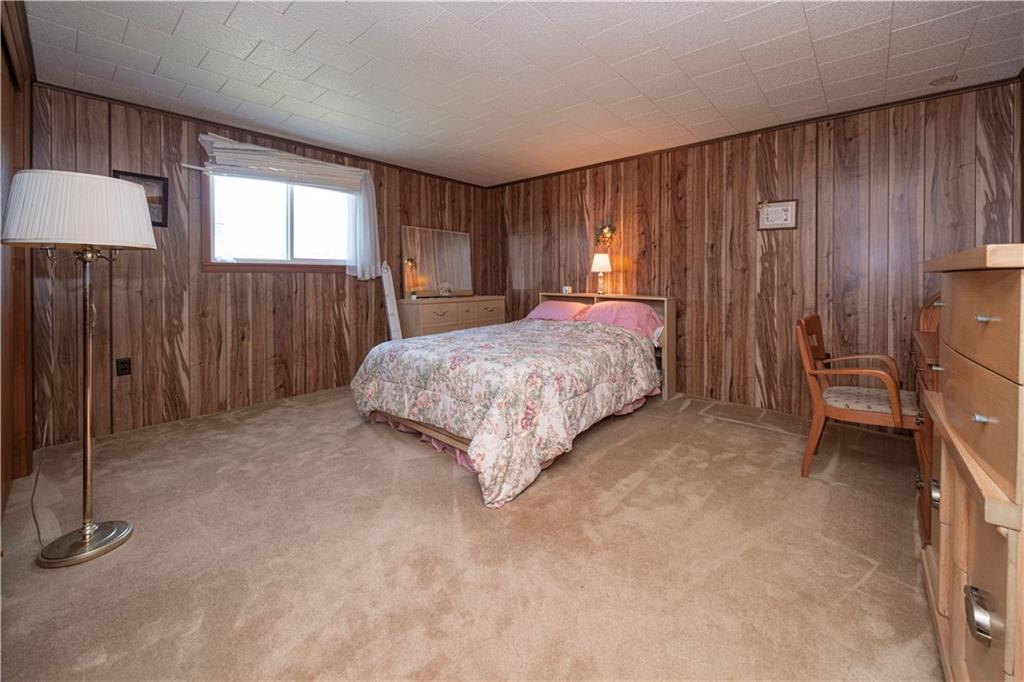 462 Crawford Run Road Cheswick, PA 15024 - Photo 26 of 39 a spacious bedroom with a bed and a dresser with mirror
