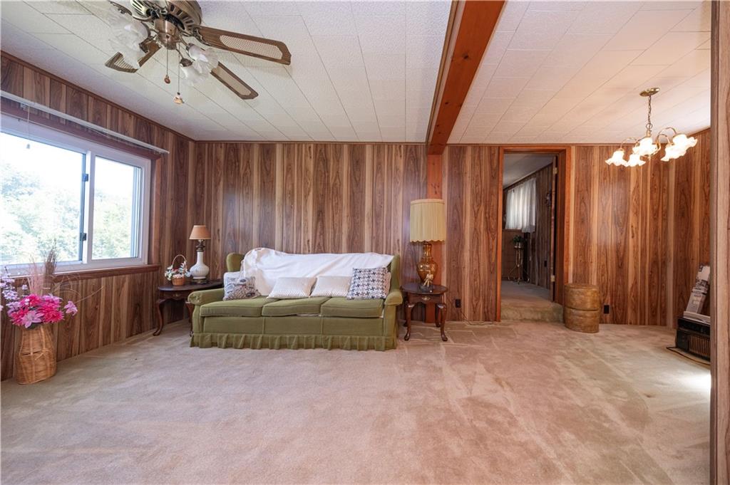 462 Crawford Run Road Cheswick, PA 15024 - Photo 28 of 39 a spacious bedroom with a bed and a chandelier