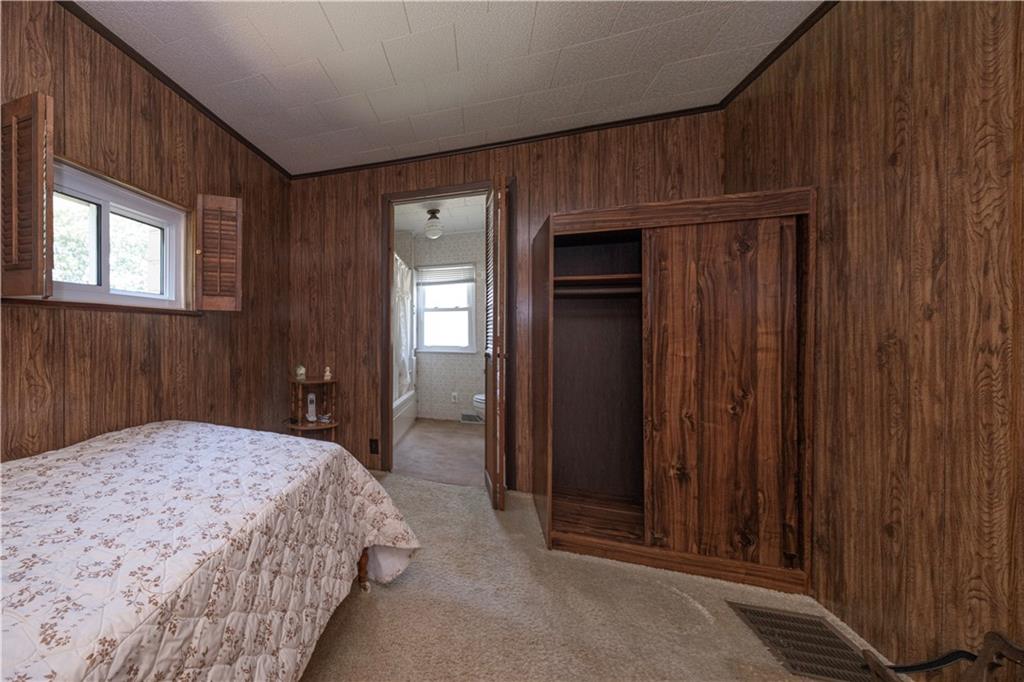 462 Crawford Run Road Cheswick, PA 15024 - Photo 30 of 39 a bedroom with a bed and a dresser