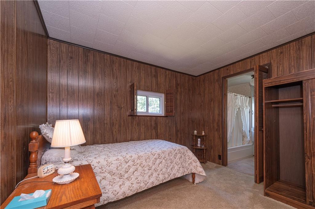 462 Crawford Run Road Cheswick, PA 15024 - Photo 35 of 39 a bedroom with a bed and a lamp