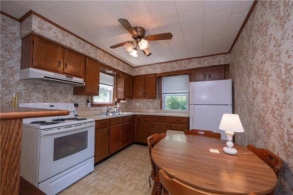 462 Crawford Run Road Cheswick, PA 15024 - Photo 39 of 39 a kitchen with a stove a sink and a refrigerator