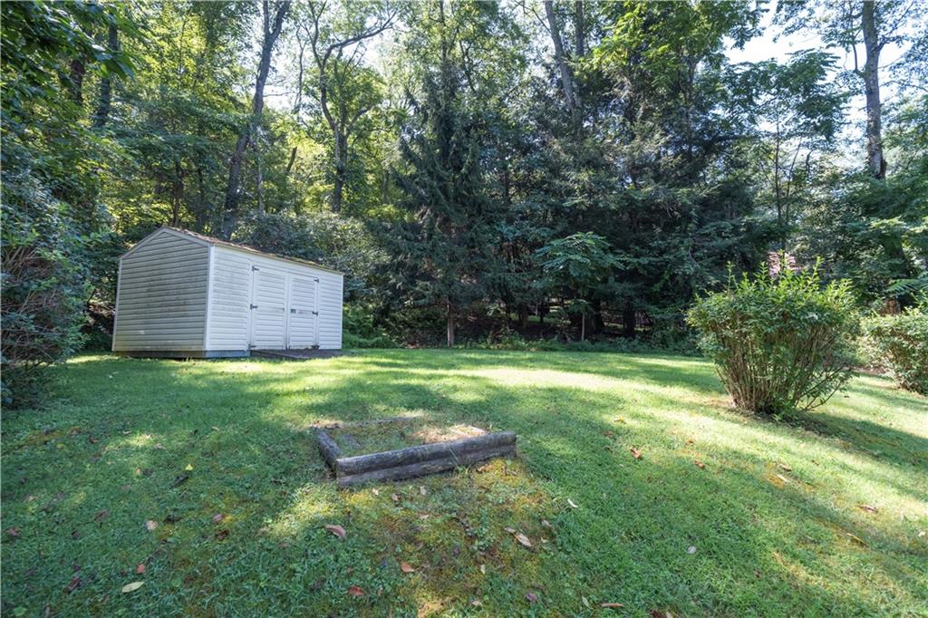 462 Crawford Run Road Cheswick, PA 15024 - Photo 8 of 39 a backyard of a house with trees and entertaining space