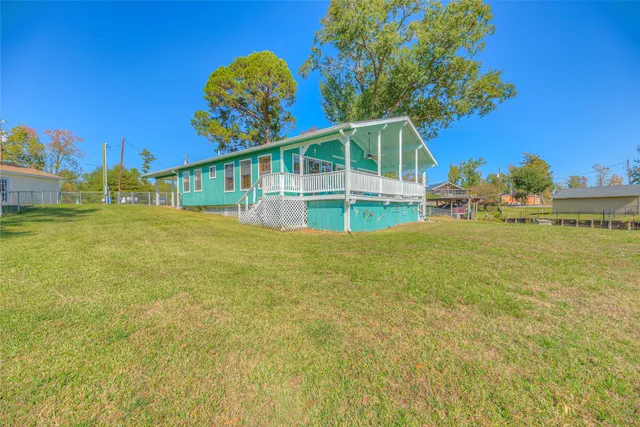 a view of a house with a big yard