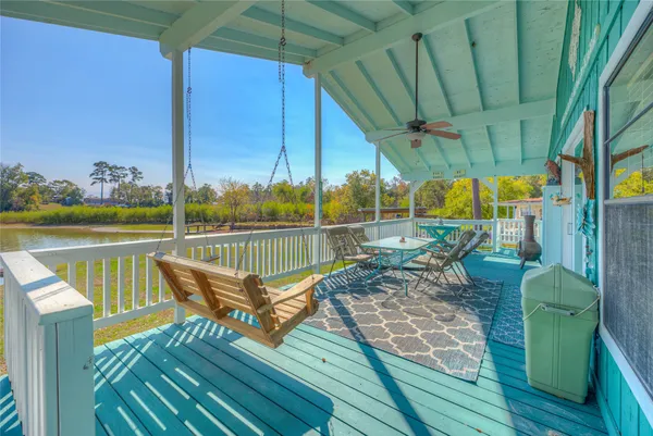 a view of a balcony with two chairs and a table