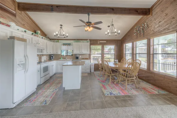 a view of a dining area with furniture window and wooden floor