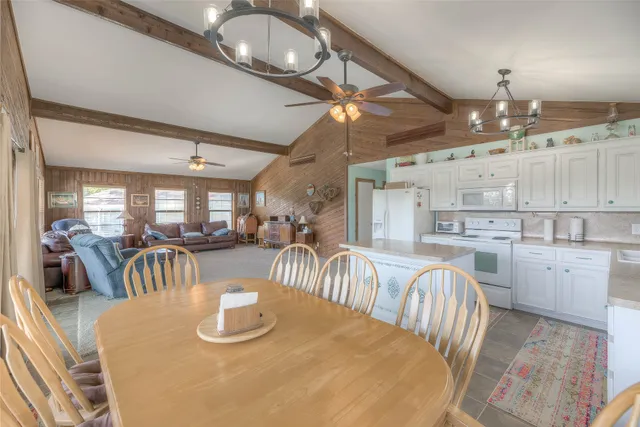 a kitchen with sink and refrigerator