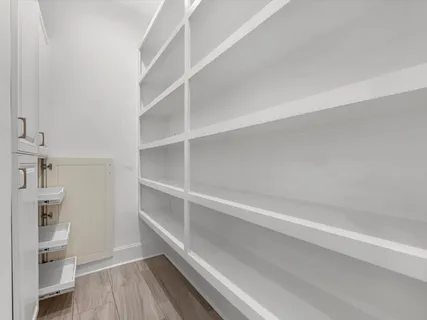 a view of an empty walk in closet