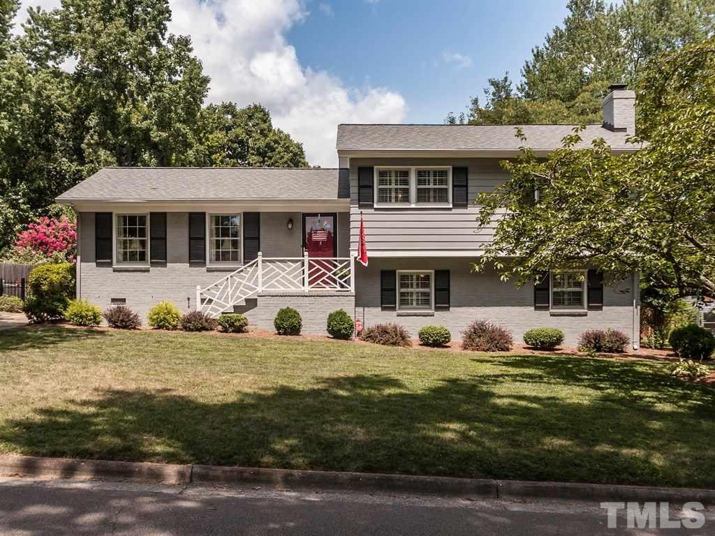 413 Crescent Court Raleigh, NC 27609 - Photo 2 of 25 a front view of a house with a yard
