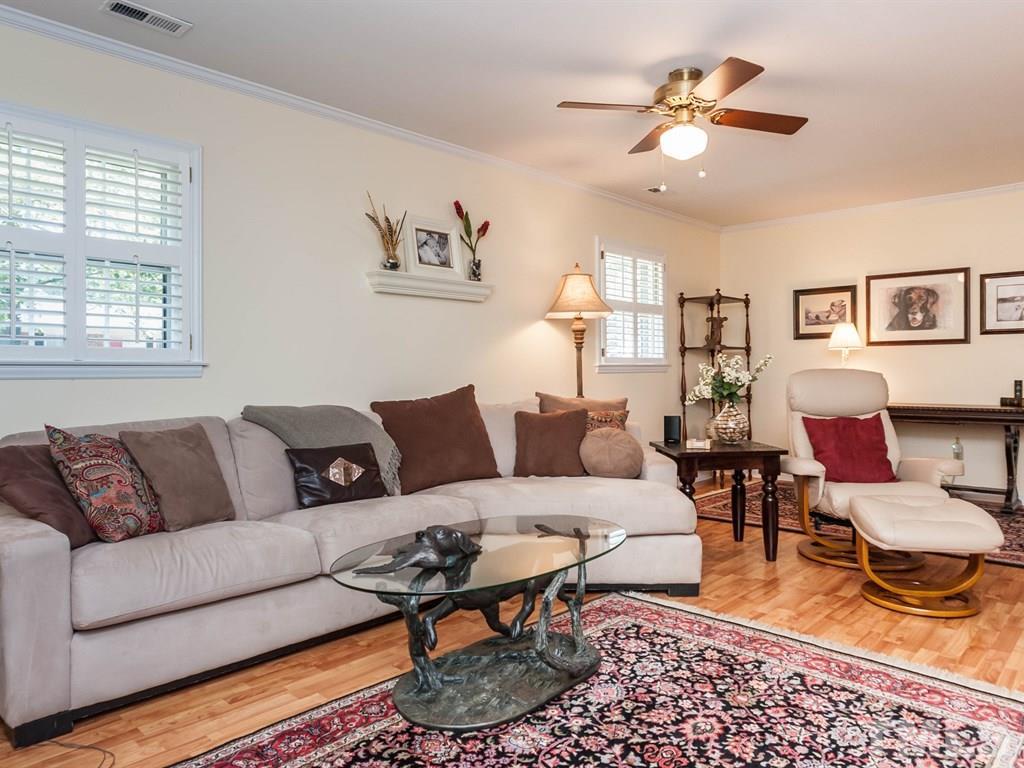413 Crescent Court Raleigh, NC 27609 - Photo 11 of 25 a living room with furniture a rug and a window