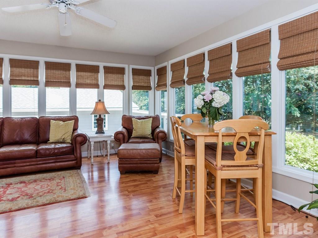 413 Crescent Court Raleigh, NC 27609 - Photo 13 of 25 a dining room with furniture window and wooden floor