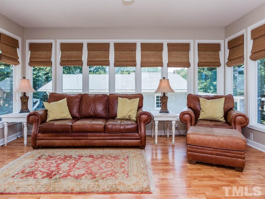 413 Crescent Court Raleigh, NC 27609 - Photo 14 of 25 a living room with furniture and a large window