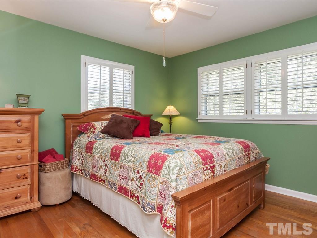 413 Crescent Court Raleigh, NC 27609 - Photo 18 of 25 a bedroom with a bed and window