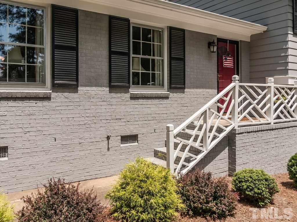 413 Crescent Court Raleigh, NC 27609 - Photo 3 of 25 a front view of a house with street