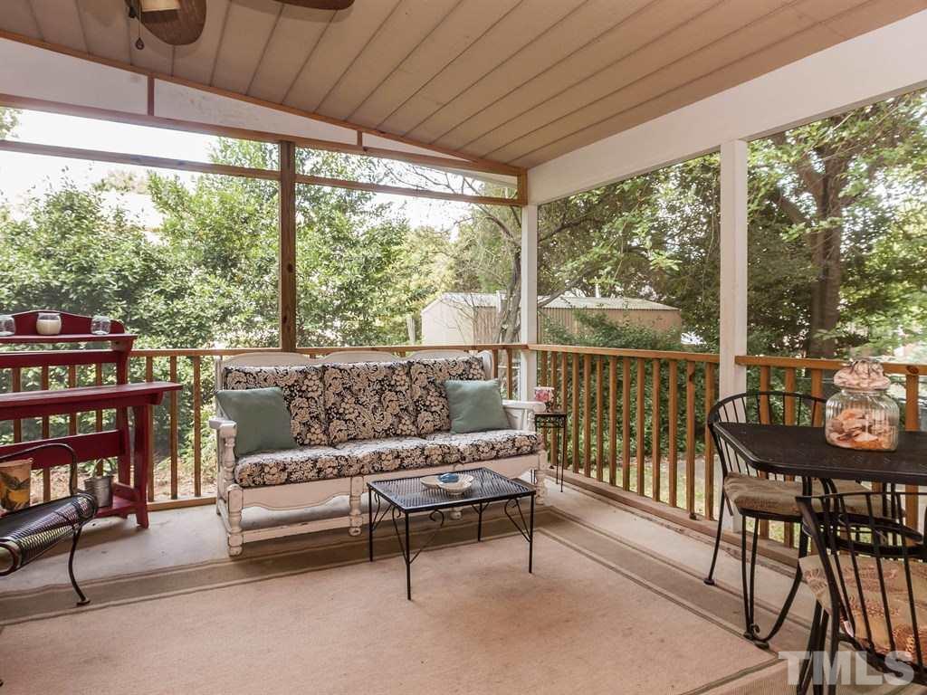 413 Crescent Court Raleigh, NC 27609 - Photo 25 of 25 a living room with furniture and a floor to ceiling window