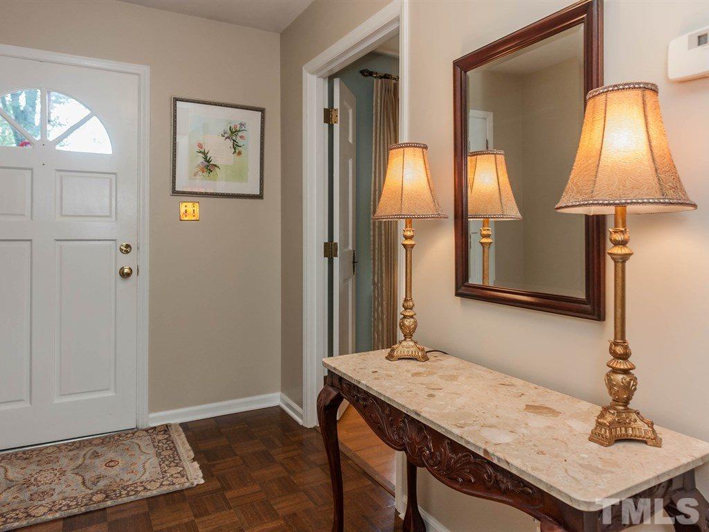 413 Crescent Court Raleigh, NC 27609 - Photo 4 of 25 a bathroom with a sink a light fixture and a window