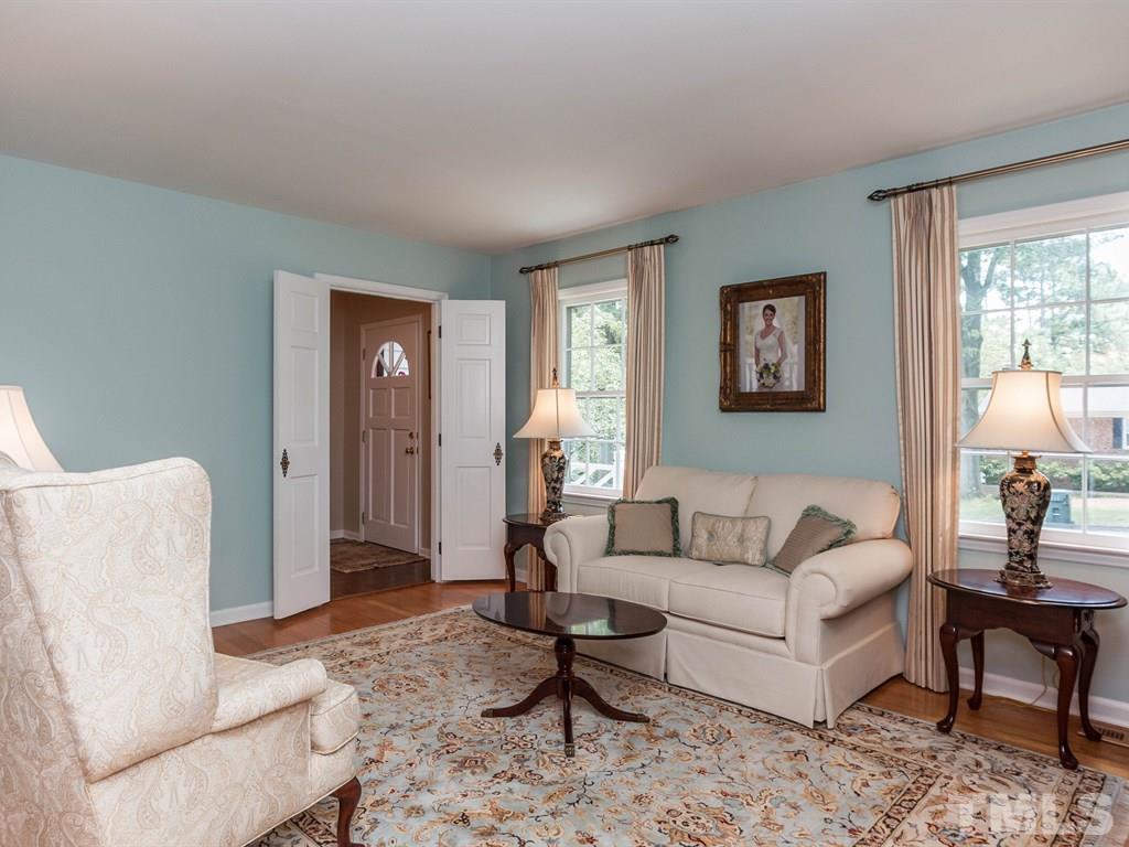 413 Crescent Court Raleigh, NC 27609 - Photo 5 of 25 a living room with furniture and a large window