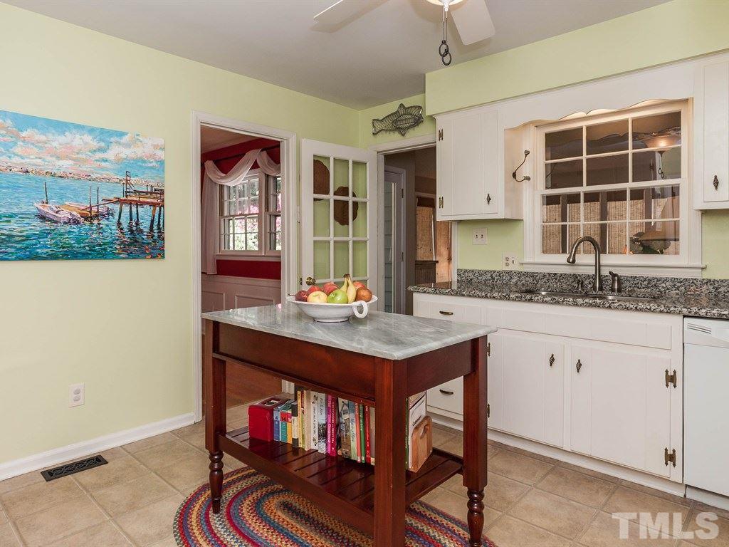 413 Crescent Court Raleigh, NC 27609 - Photo 9 of 25 a kitchen with a sink cabinets and window